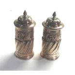 Pair of antique silver peppers London silver hallmarks measure approx 9ct tall weight 100g