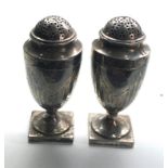 Pair of Georgian silver peppers each measure approx 10cm tall weight 163g hallmarks worn to 1 as