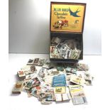 Large selection of cigarette cards in toffee tin