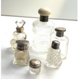 Selection of antique silver top bottles perfume etc largest measures approx 14cm tall