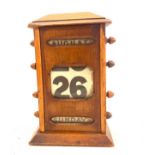 Antique perpetual desktop calendar, height approximately 9 inches