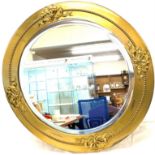 Vintage brass circular mirror, approximately 23.5 inches in diameter/height.