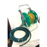 Hose pipe on reel and one other