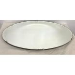 Antique oval frameless mirror, approximate measurement: Width 26 inches, Height 15 inches