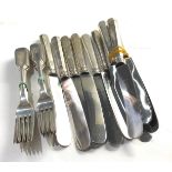 12 Latvian silver forks and selection of silver handled table knives total weight 1700g forks weight