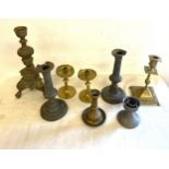 Selection of brass and pewter candle sticks