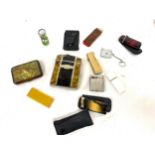 Tray of cigarette cases and novelty lighters