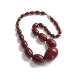 Vintage cherry amber bakelite bead necklace with internal streaking, 51.6g