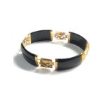 14ct gold onyx oriental panel bracelet (17.6g)