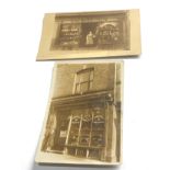 2 early 1900s shop front real photo postcards