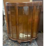 Walnut bow fronted china cabinet, approximate measurements: Height 48 inches, Width 38 inches, Depth