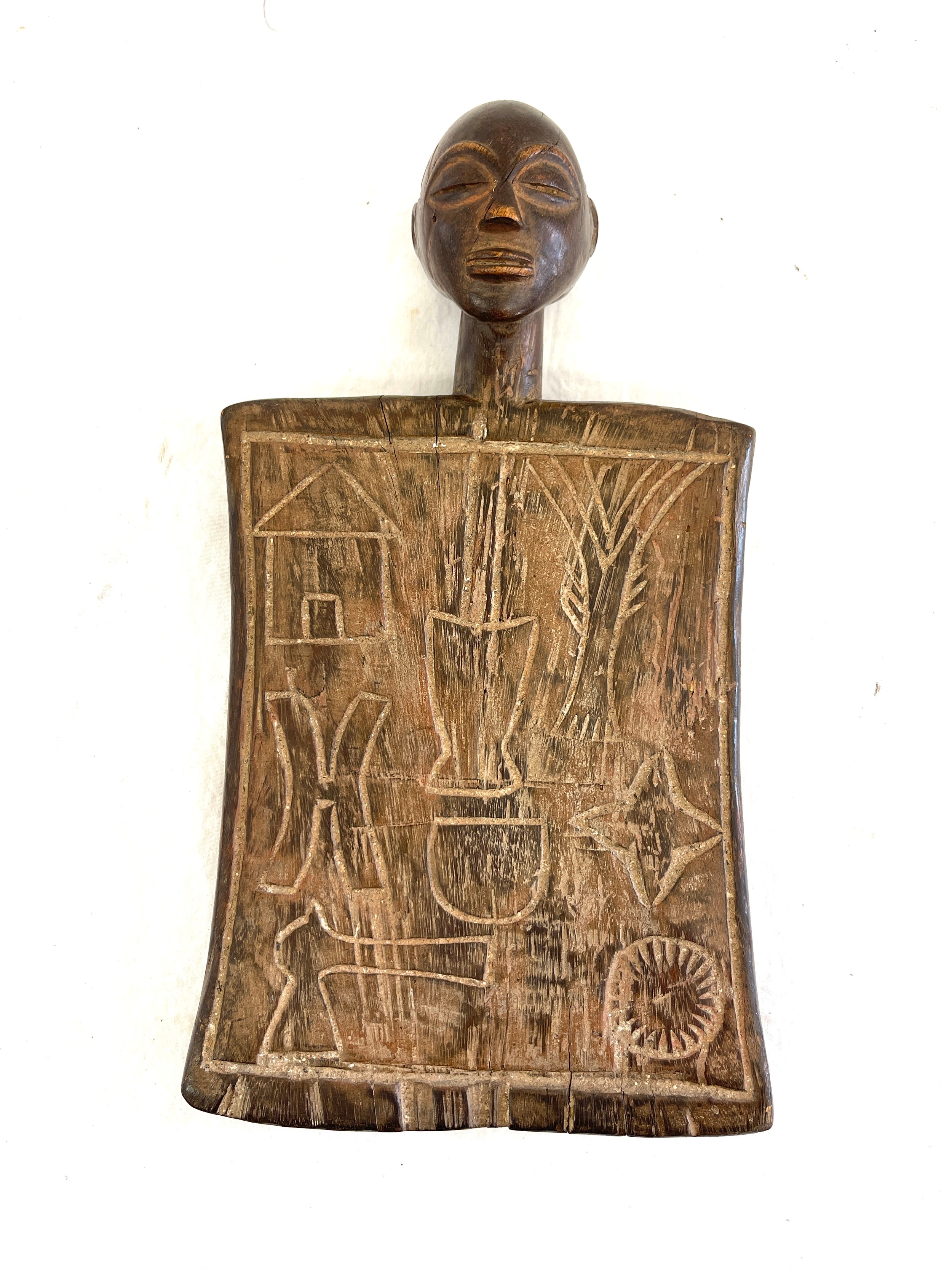 Vintage unusual African tribal board, approximate measurements: Height 12.5, Width 7 inches