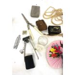 Tray of assorted items to include fans, napkins rings, silver brooch, silver cheroot holder,