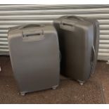 Pair Revelation hard shell suitcases