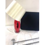 Red standard lamp, wheelchair cushion, metal towel rail