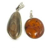 2 Ladies Amber and silver pendants, total approximate weight 18.9g