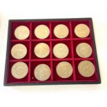 Tray of 12, £5 coins set within tray