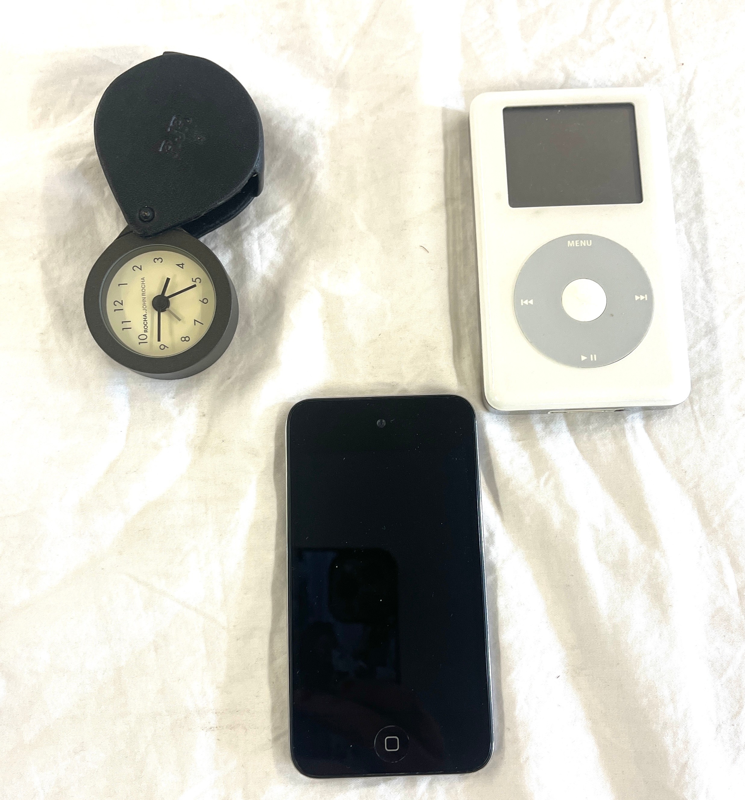 Ipod touch Nano + 1 other ipod and a Rocha.john rocha clock