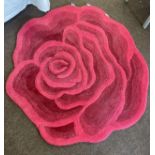 Red flower shaped lounge rug, approximate measurements: diameter: 51 inches