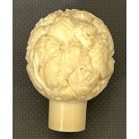Bone carved stick head depicting lions, approximate measurements: 2 inches