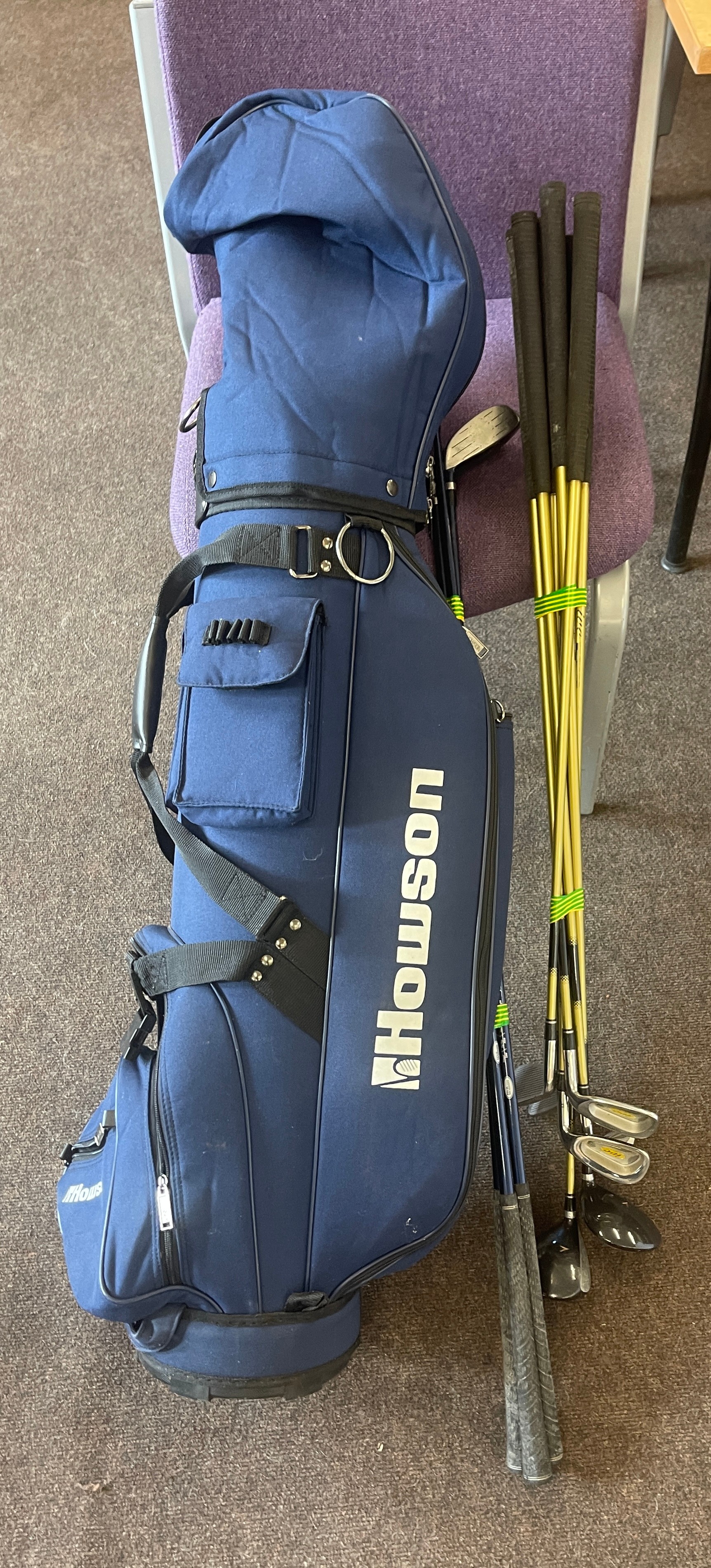 Howson golf bag with a selection of golf clubs