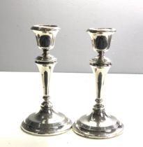 Pair of silver candlesticks height 18cm filled bases Birmingham silver hallmarks age related wear
