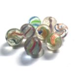 8 antique glass marbles measure approx 24mm smallest 21mm