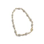 9ct yellow & white gold diamond set eye fish chain bracelet (2.8g)