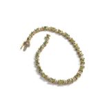 9ct gold emerald & diamond tennis bracelet (6.2g)