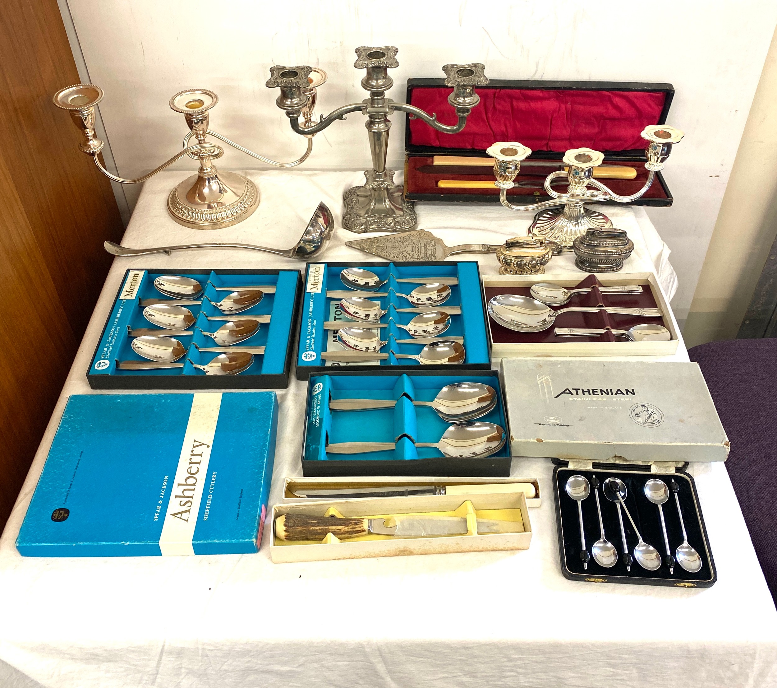 Large selection of silver plated items to include cutlery, candle sticks etc
