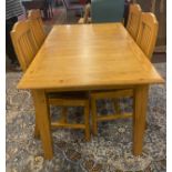 Oak extending table and 4 chairs measures approx 86" long when fully extended, closed 58" long 42"
