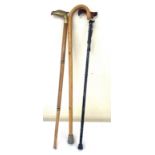 Selection of 3 walking sticks, one has a brass eagle top