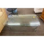 Metal and glass coffee table measures approx 16" tall by 48" wide 26" depth