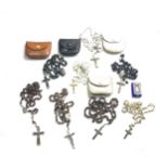 Selection of vintage rosary bead necklaces and leather bags