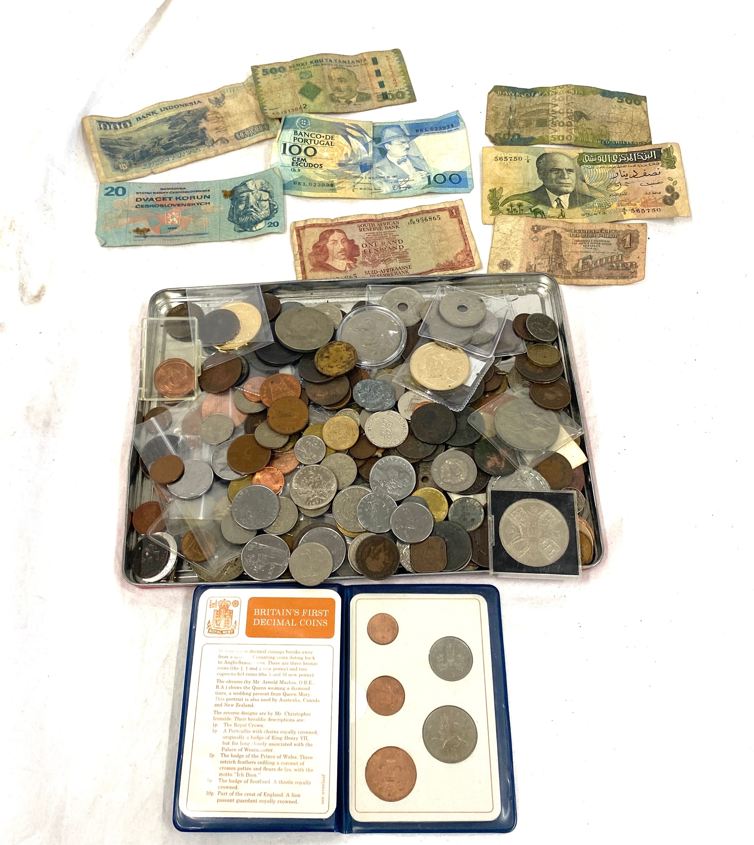 Large selection of bank notes and coins