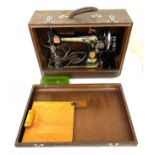 Vintage cased Singer sewing machine and accessories