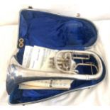 Boxed vintage Trombone with music sheets