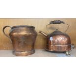 A vintage brass kettle and jug