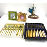 Selection of items to include silver plated cutlery, photo frames and an ornament