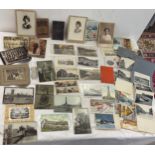 Selection of antique real photo post cards, photos behind glass, letters etc