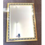 Gilt framed mirror with bevelled edge measures approx 33" wide 14" tall