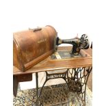 Vintage singer sewing machine with tredal table
