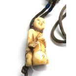 Antique ivory netsuke on original cord