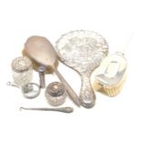 Selection of silver items includes mirror brushes scent bottles etc