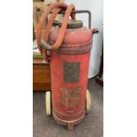 Vintage fire extinguisher on wheels, approximate height: 38 inches, width 15 inches