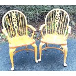 Pair of oak wheel back carver chairs