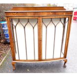 Oak glass display cabinet with ball and claw feet measures approx 52" tall 47" wide 15" depth