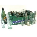 Large selection of vintage medicine bottles, approximately 60