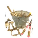 Large coal bucket filled with assorted vintage tools