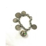 Vintage silver ladies bracelet to include the following mounted coins: 1955 Australia 3p, 1943 USA 1